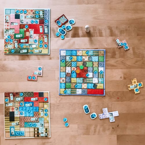 A board game with board and buttons